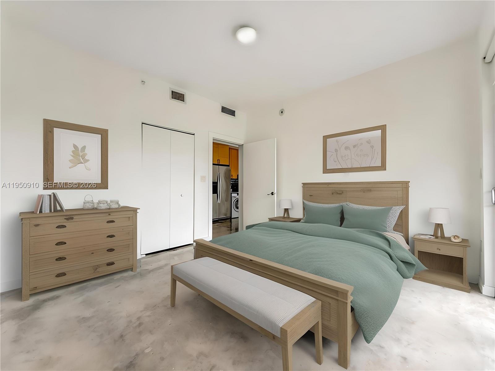 771 Northwest 1st Street, Unit 302 Miami, FL 33128 - Photo 14 of 18 a bed room with a bed and a dresser