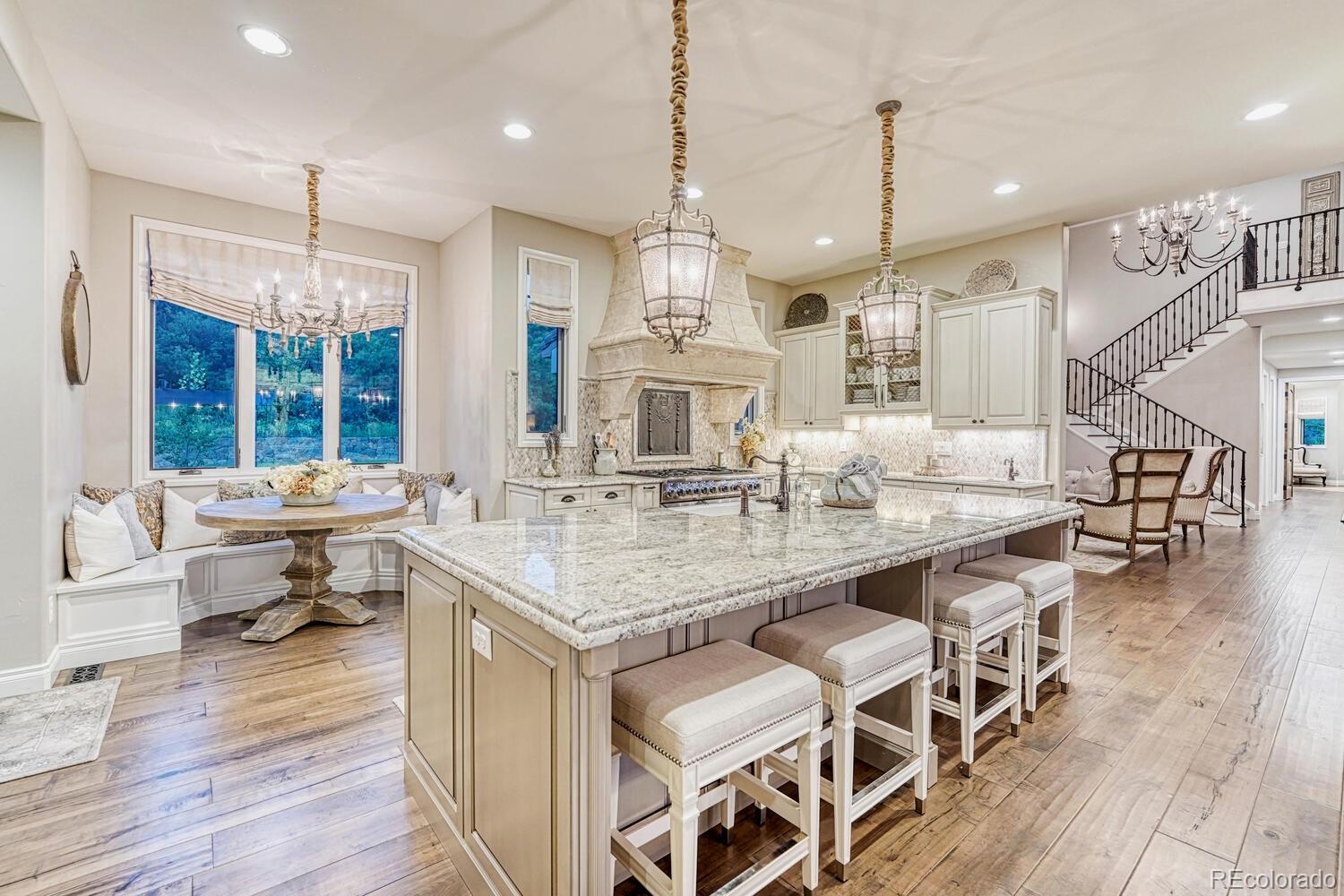 2236 Beechnut Place Castle Rock, CO 80108 - Photo 11 of 40 a kitchen with center island table and chairs
