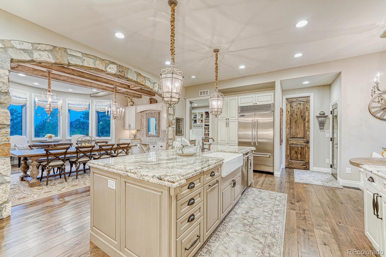 2236 Beechnut Place Castle Rock, CO 80108 - Photo 12 of 40 an open kitchen with a table and chairs