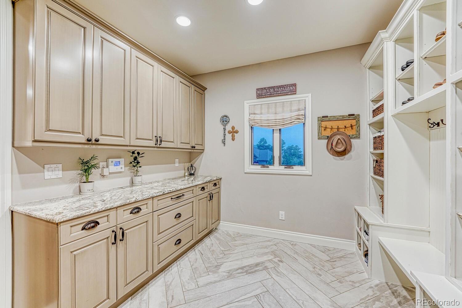 2236 Beechnut Place Castle Rock, CO 80108 - Photo 16 of 40 a spacious bathroom with a granite countertop sink and a mirror
