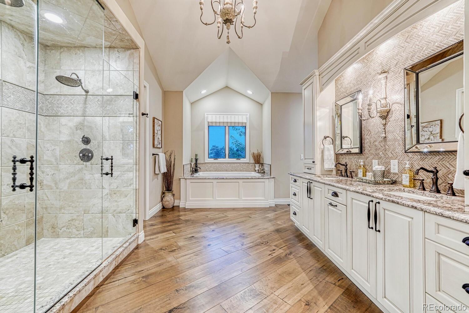 2236 Beechnut Place Castle Rock, CO 80108 - Photo 21 of 40 a bathroom with a double vanity sink a mirror and a shower