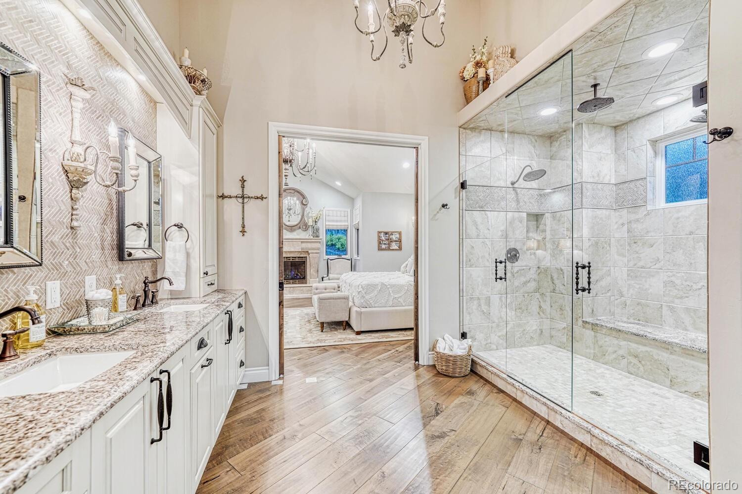 2236 Beechnut Place Castle Rock, CO 80108 - Photo 22 of 40 a spacious bathroom with a granite countertop sink mirror and shower
