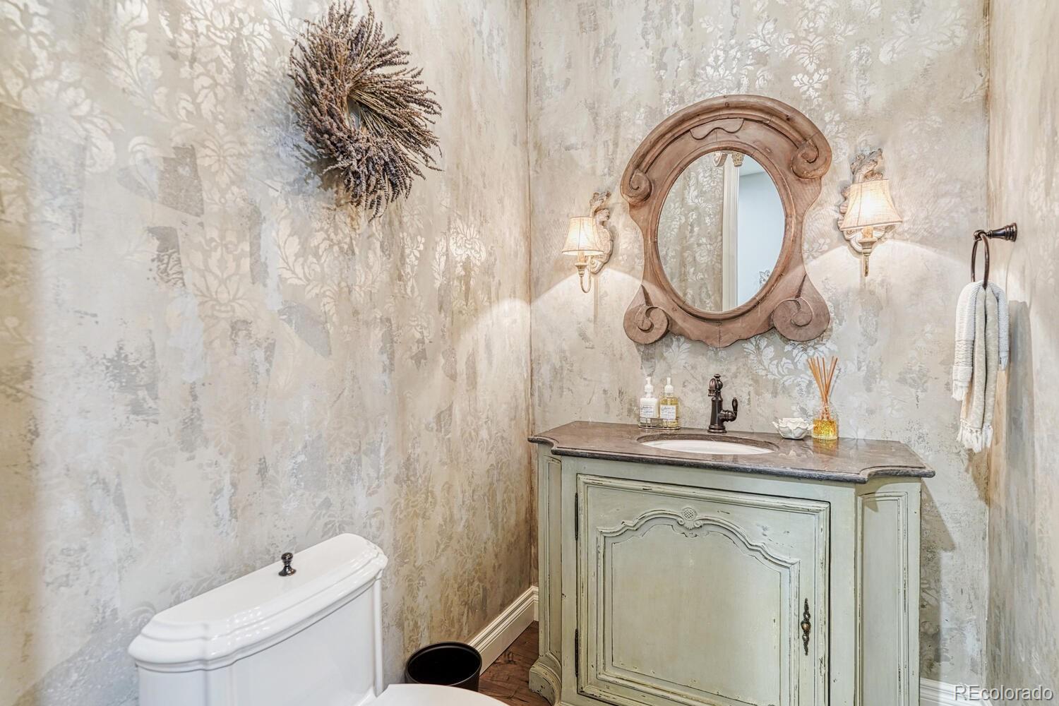 2236 Beechnut Place Castle Rock, CO 80108 - Photo 24 of 40 a bathroom with a granite countertop toilet sink and mirror
