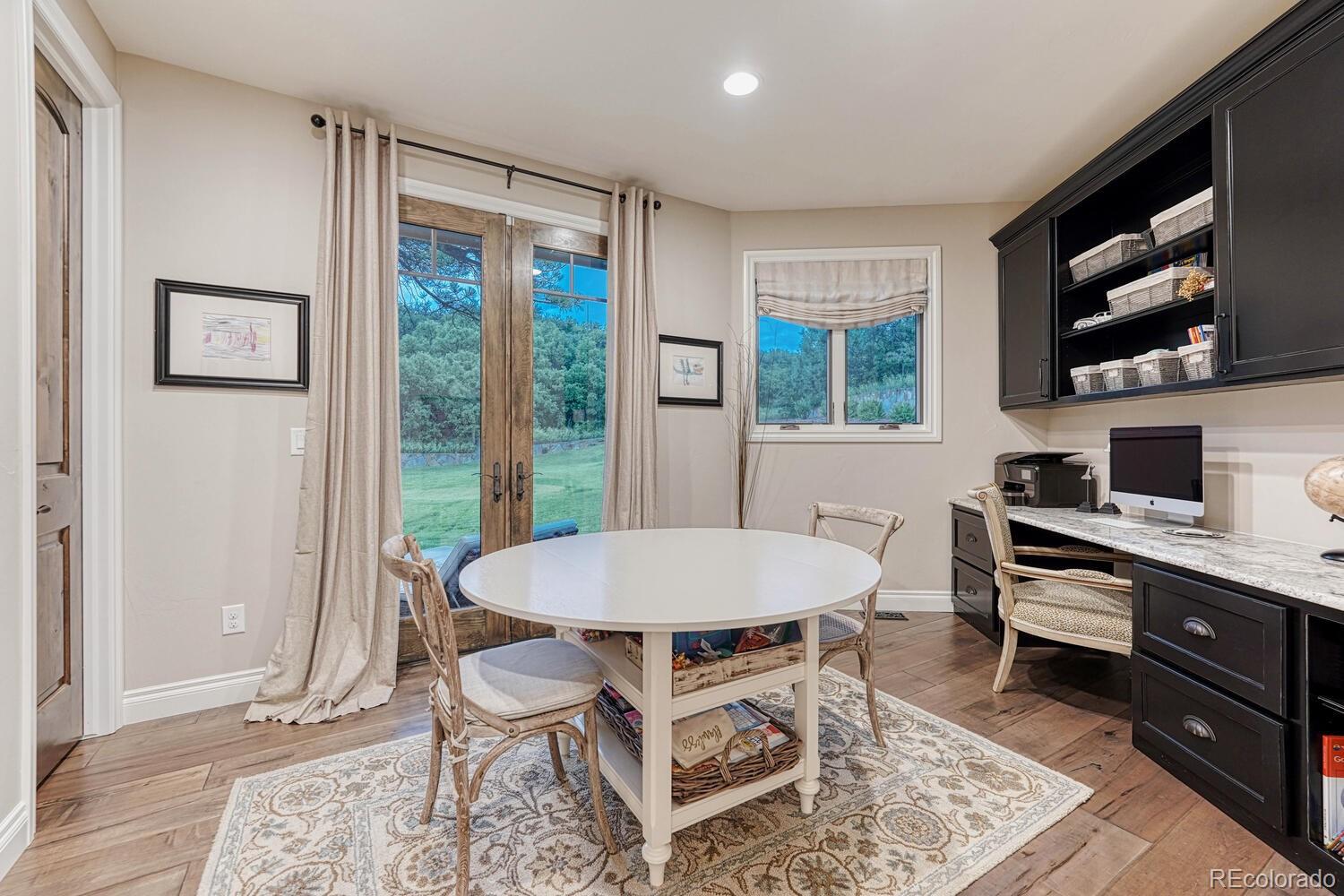 2236 Beechnut Place Castle Rock, CO 80108 - Photo 25 of 40 a view of a dining room with furniture window and outside view