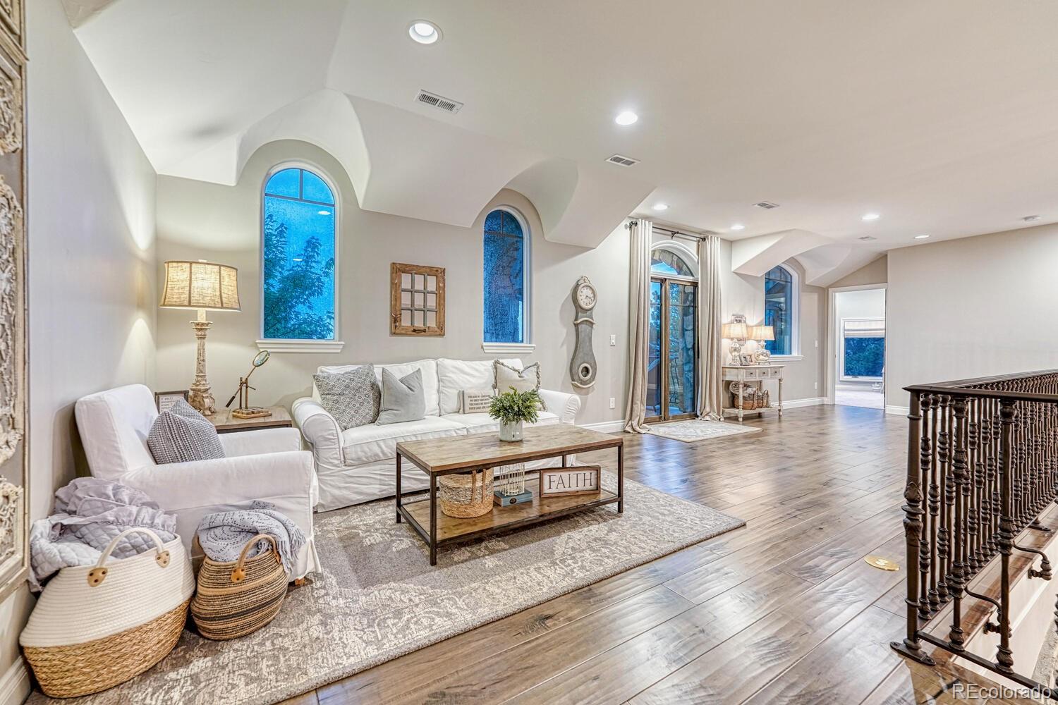2236 Beechnut Place Castle Rock, CO 80108 - Photo 26 of 40 a living room with furniture and wooden floor