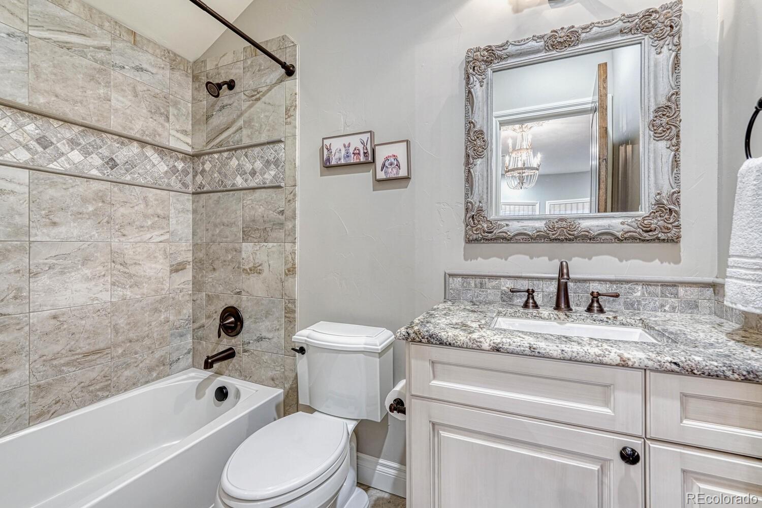 2236 Beechnut Place Castle Rock, CO 80108 - Photo 30 of 40 a bathroom with a granite countertop toilet sink and bathtub