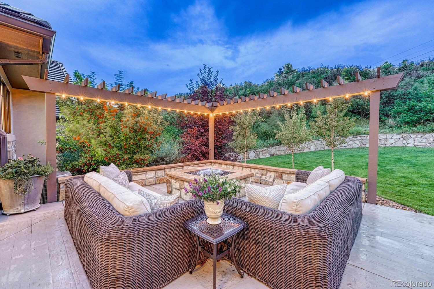 2236 Beechnut Place Castle Rock, CO 80108 - Photo 36 of 40 a view of a patio with couches table and chairs and potted plants