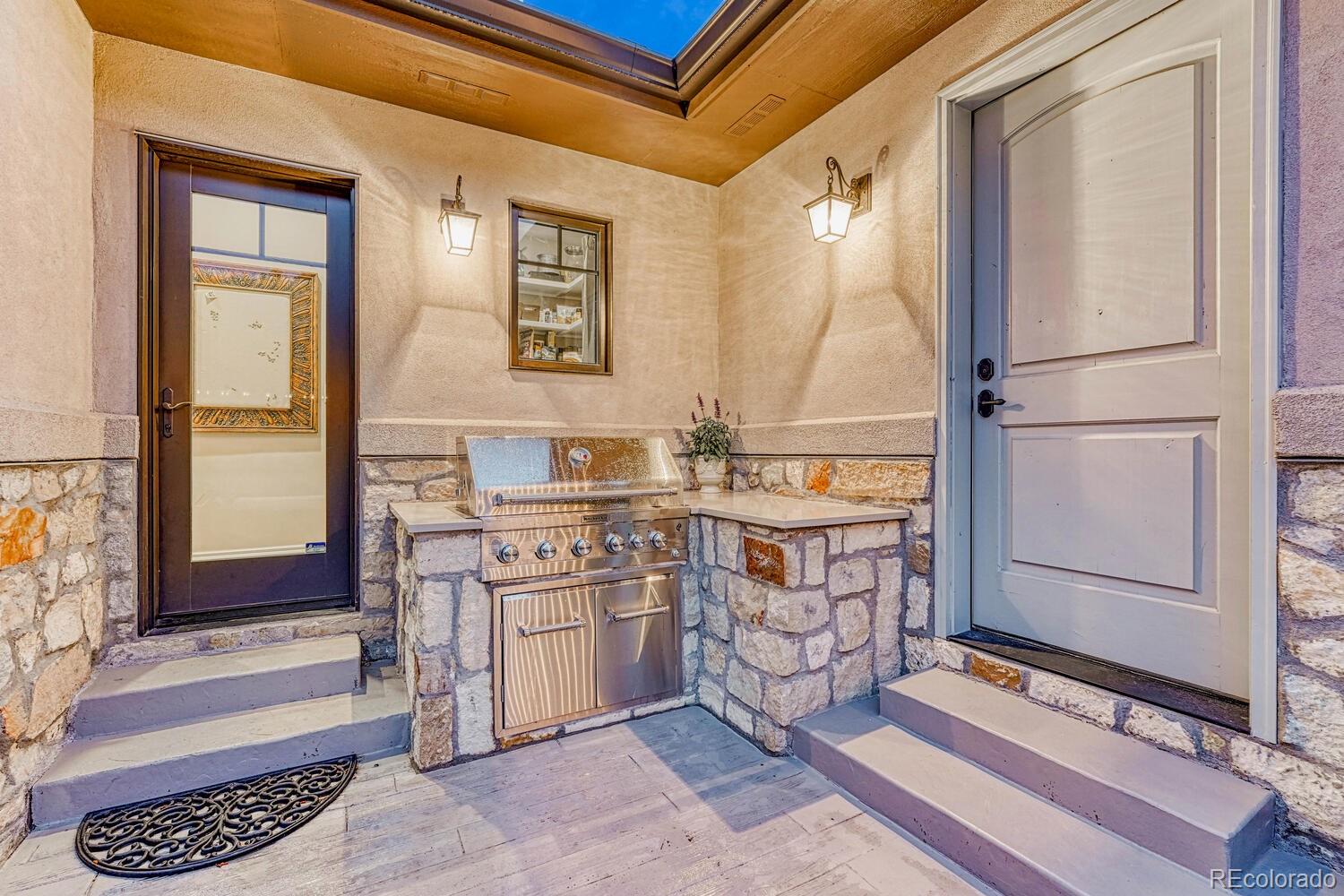 2236 Beechnut Place Castle Rock, CO 80108 - Photo 37 of 40 a room with mirror cabinets and a sink