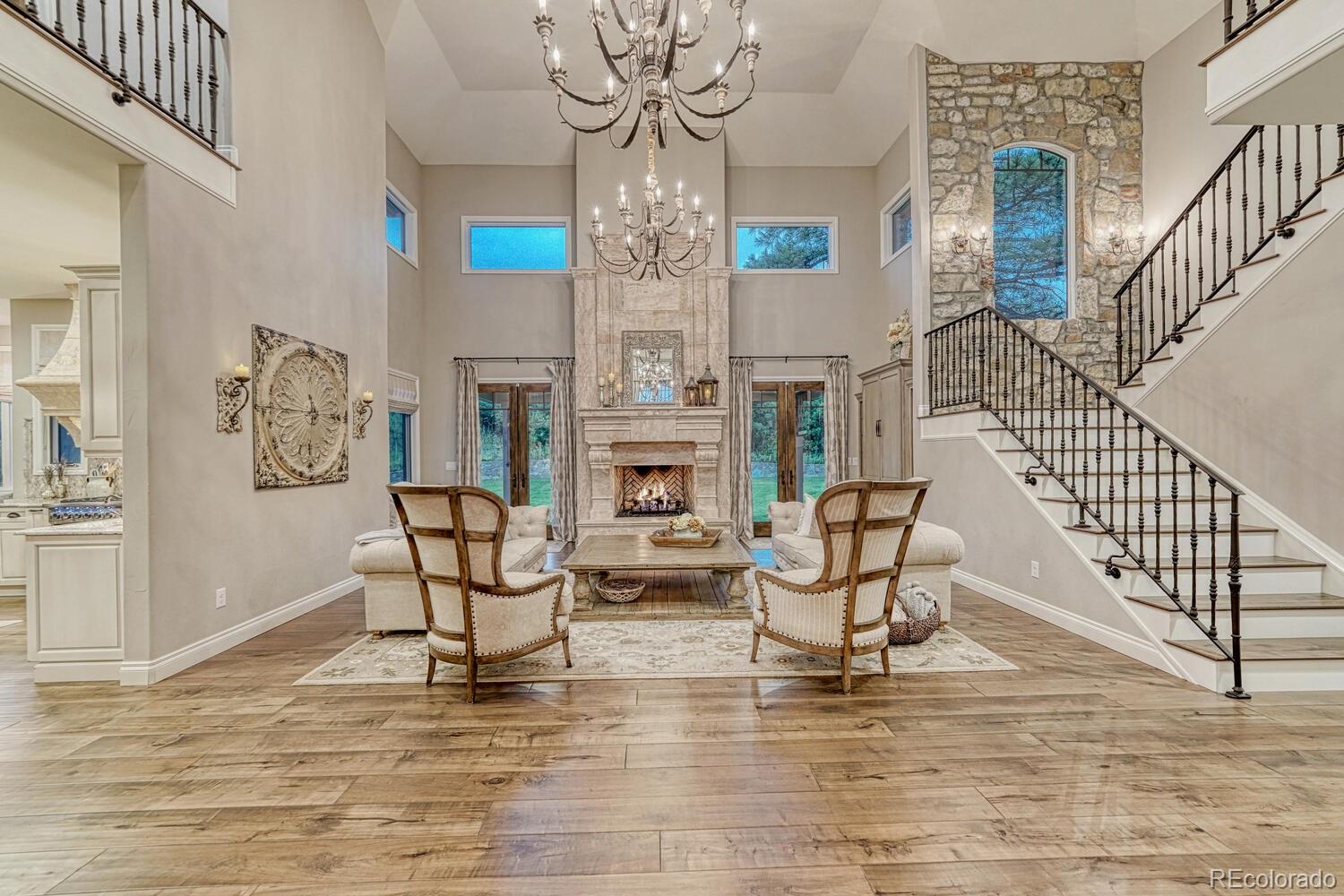 2236 Beechnut Place Castle Rock, CO 80108 - Photo 8 of 40 a living room with fireplace furniture and a wooden floor