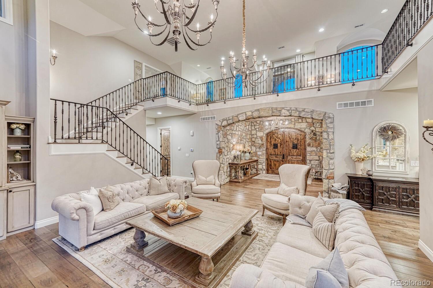2236 Beechnut Place Castle Rock, CO 80108 - Photo 9 of 40 a living room with furniture a chandelier and a chandelier