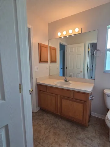 a bathroom with a double vanity sink and mirror