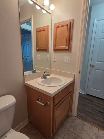 a utility room with a sink and a toilet