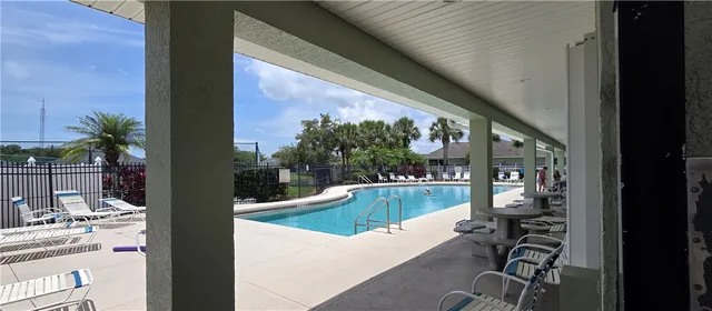 a view of a living room and balcony