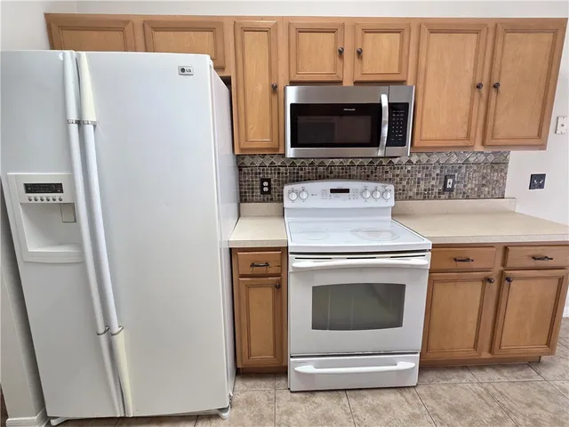 a kitchen with a stove and a microwave