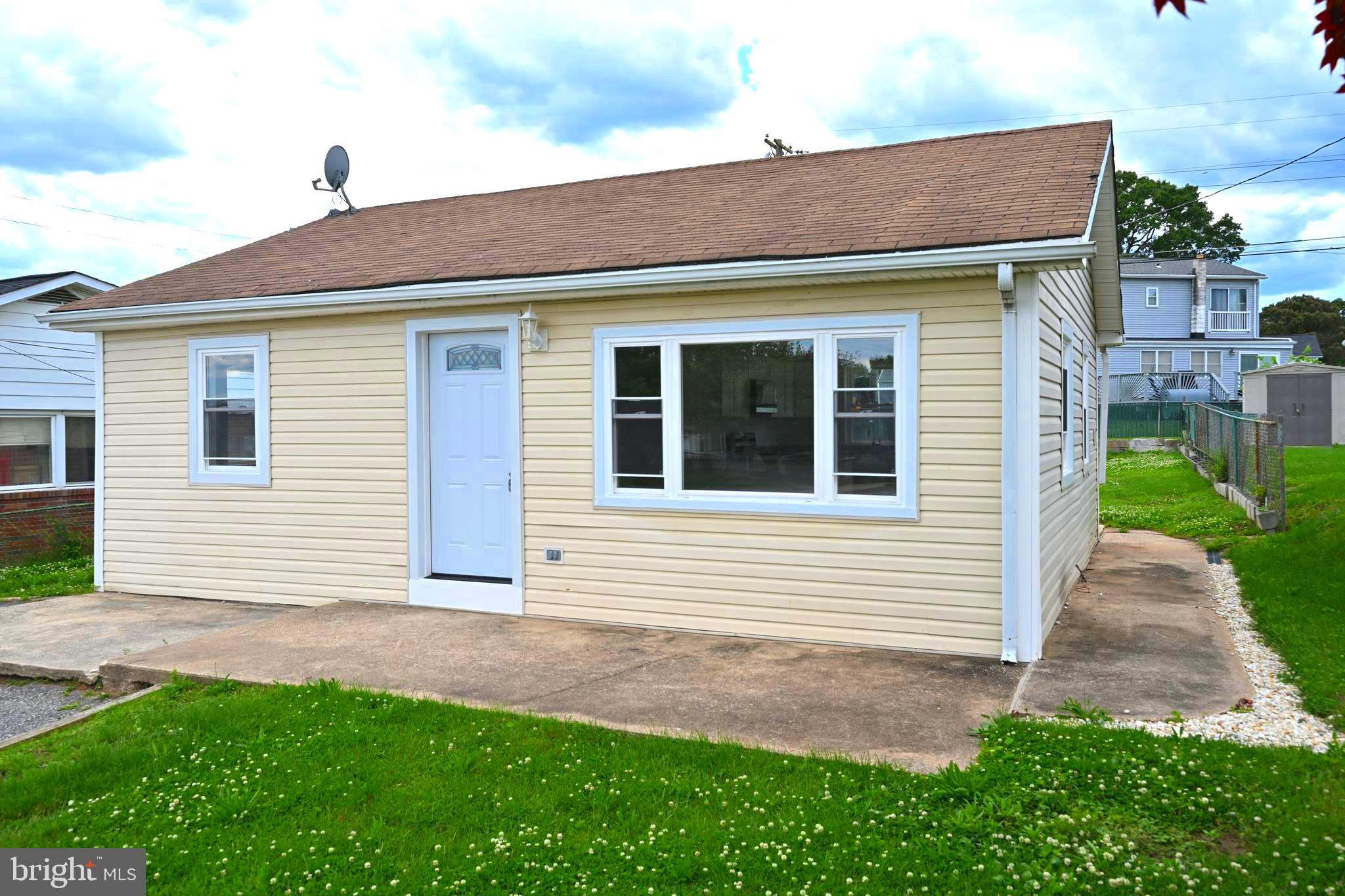 34 Compass Road East Middle River, MD 21220 - Photo 15 of 25 a front view of a house with a yard