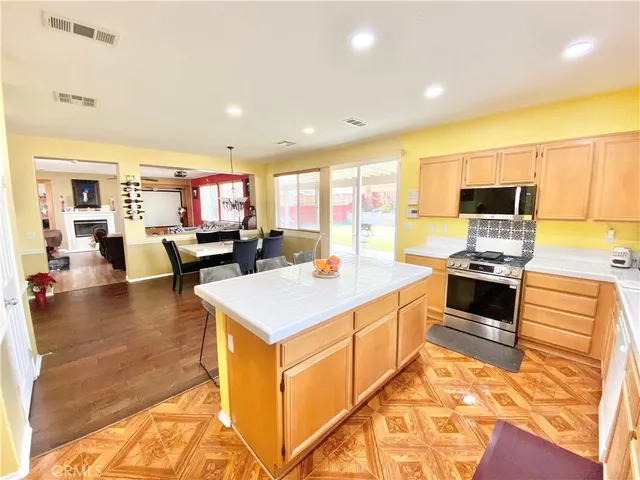 a kitchen with a sink counter top space and stainless steel appliances