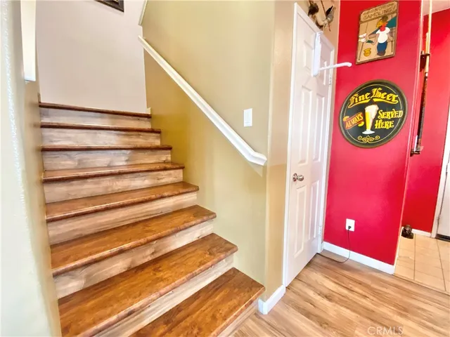 a view of an entryway with wooden floor