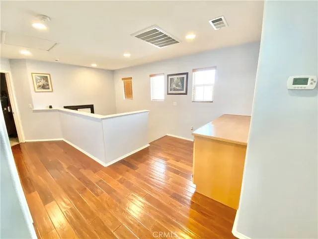 a kitchen with a sink and a refrigerator