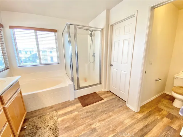 a bathroom with a tub shower and a sink