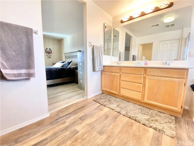 a bathroom with a tub sink and mirror