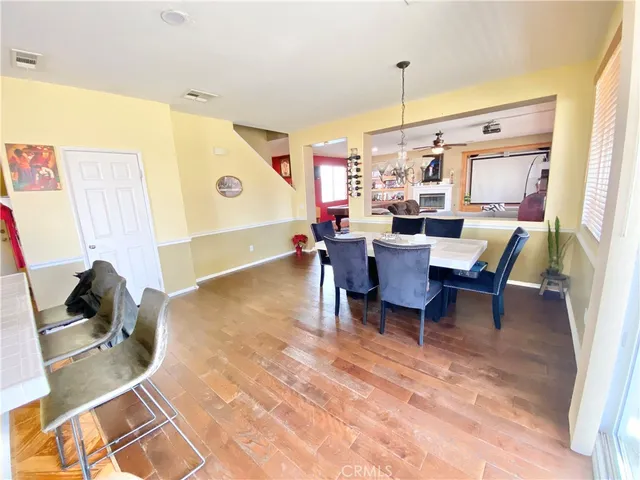 a dining room with furniture and window