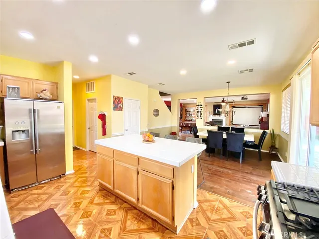 a large kitchen with a large counter top appliances and cabinets