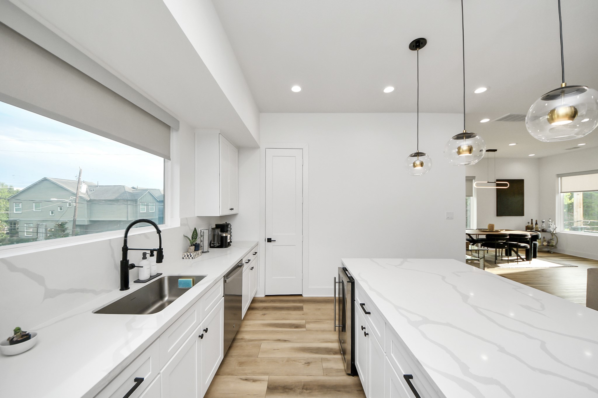 1044 West 17th Street Houston, TX 77008 - Photo 23 of 48 a kitchen with a sink and a large window