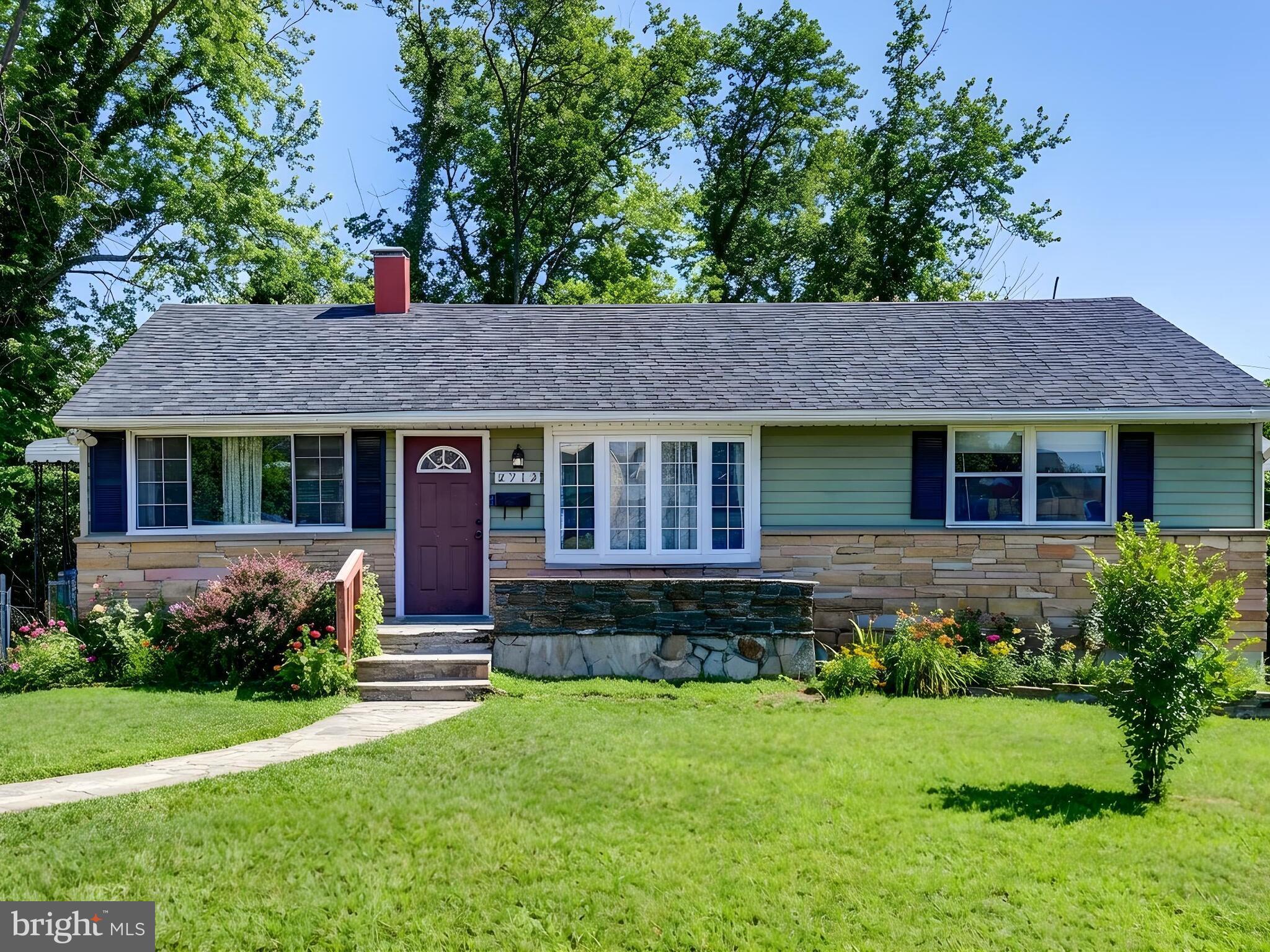 2712 Burridge Road Baltimore, MD 21234 - Photo 1 of 32 a view of a house with a yard and plants
