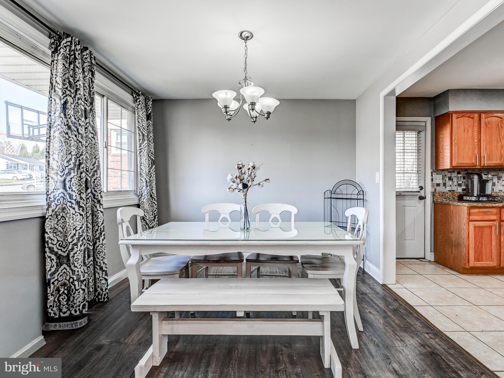 2712 Burridge Road Baltimore, MD 21234 - Photo 11 of 32 a view of a dining room with furniture window and wooden floor
