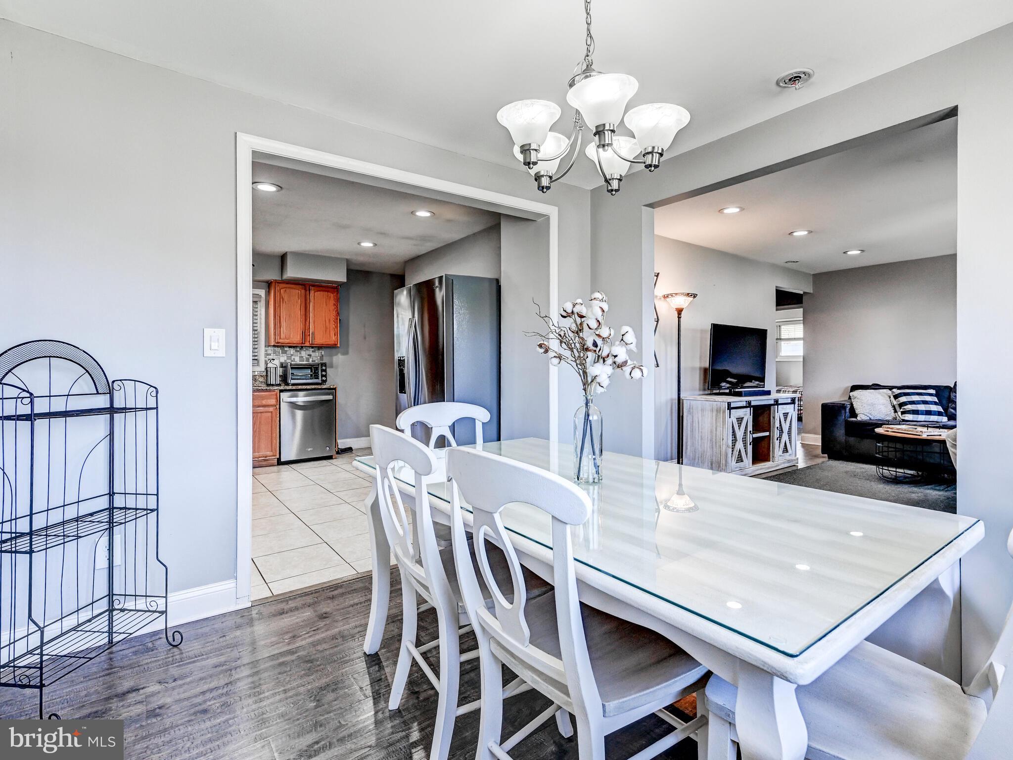 2712 Burridge Road Baltimore, MD 21234 - Photo 12 of 32 a view of a dining room with furniture and wooden floor