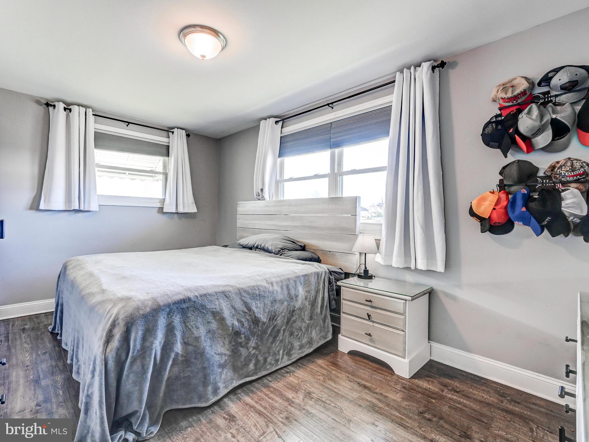 2712 Burridge Road Baltimore, MD 21234 - Photo 18 of 32 a bedroom with a bed and a window