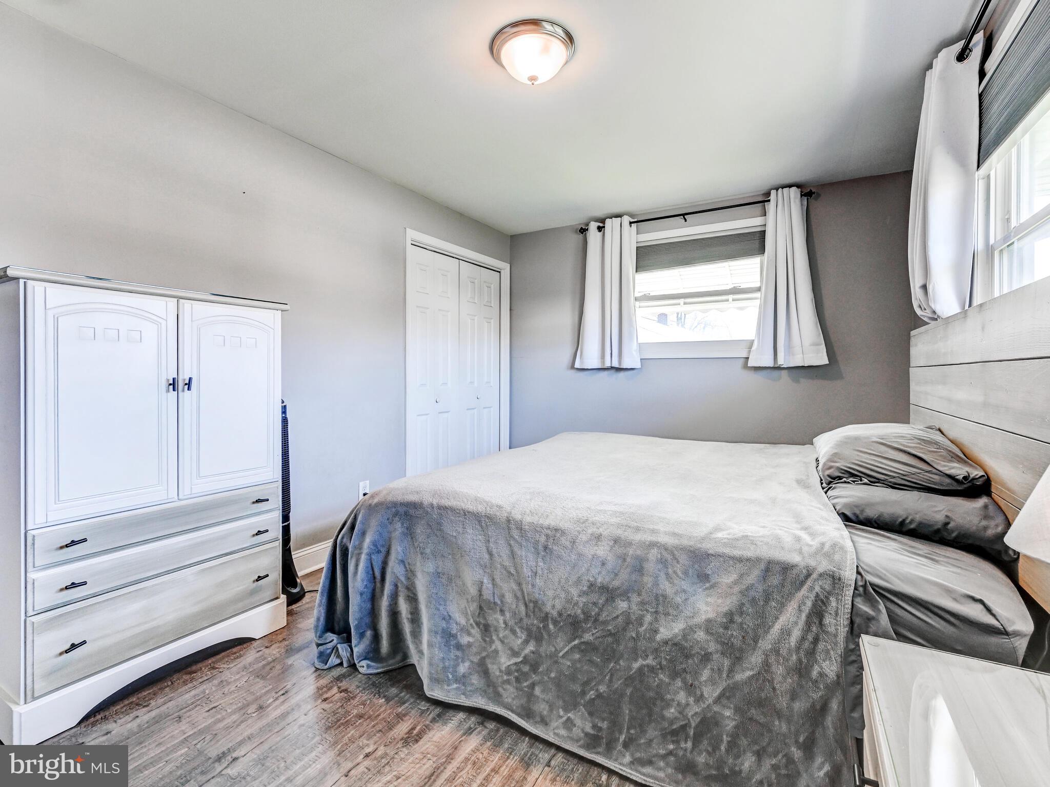 2712 Burridge Road Baltimore, MD 21234 - Photo 19 of 32 a bedroom with a bed and a dresser