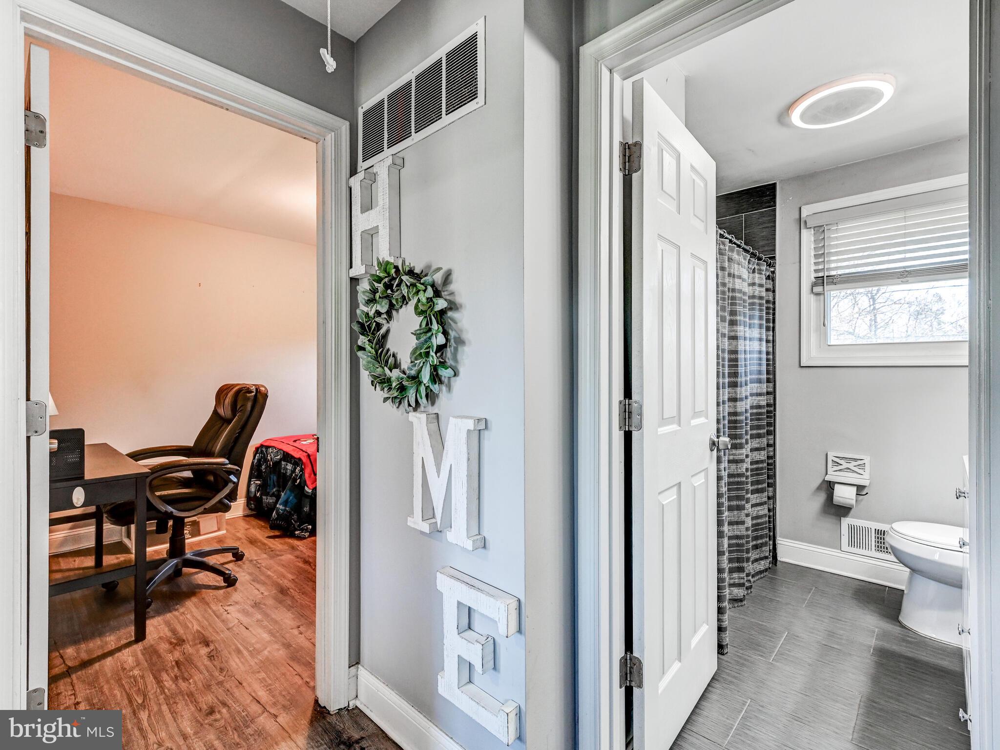 2712 Burridge Road Baltimore, MD 21234 - Photo 21 of 32 a workspace with furniture and a potted plant