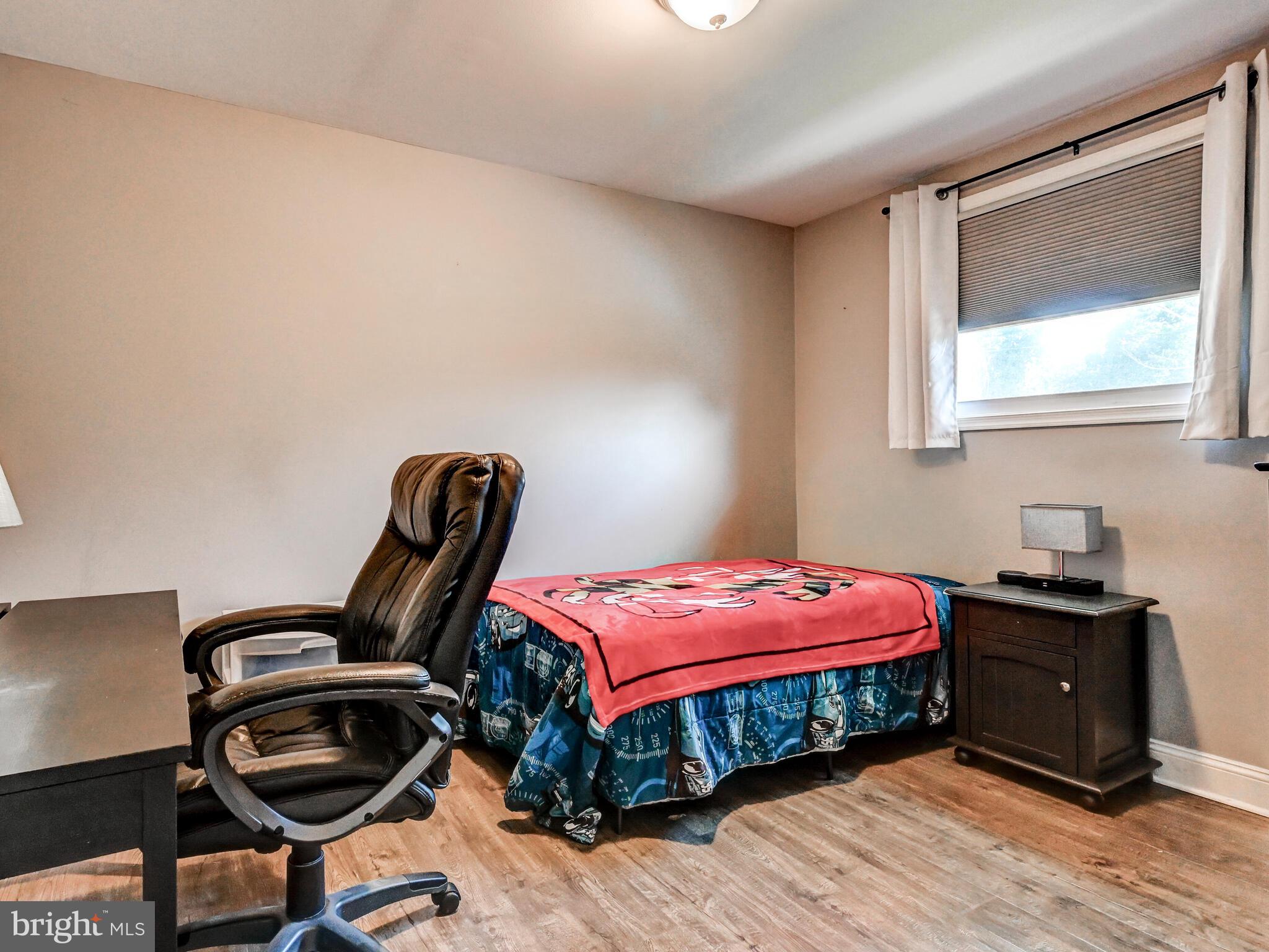 2712 Burridge Road Baltimore, MD 21234 - Photo 22 of 32 a bedroom with a bed and a window