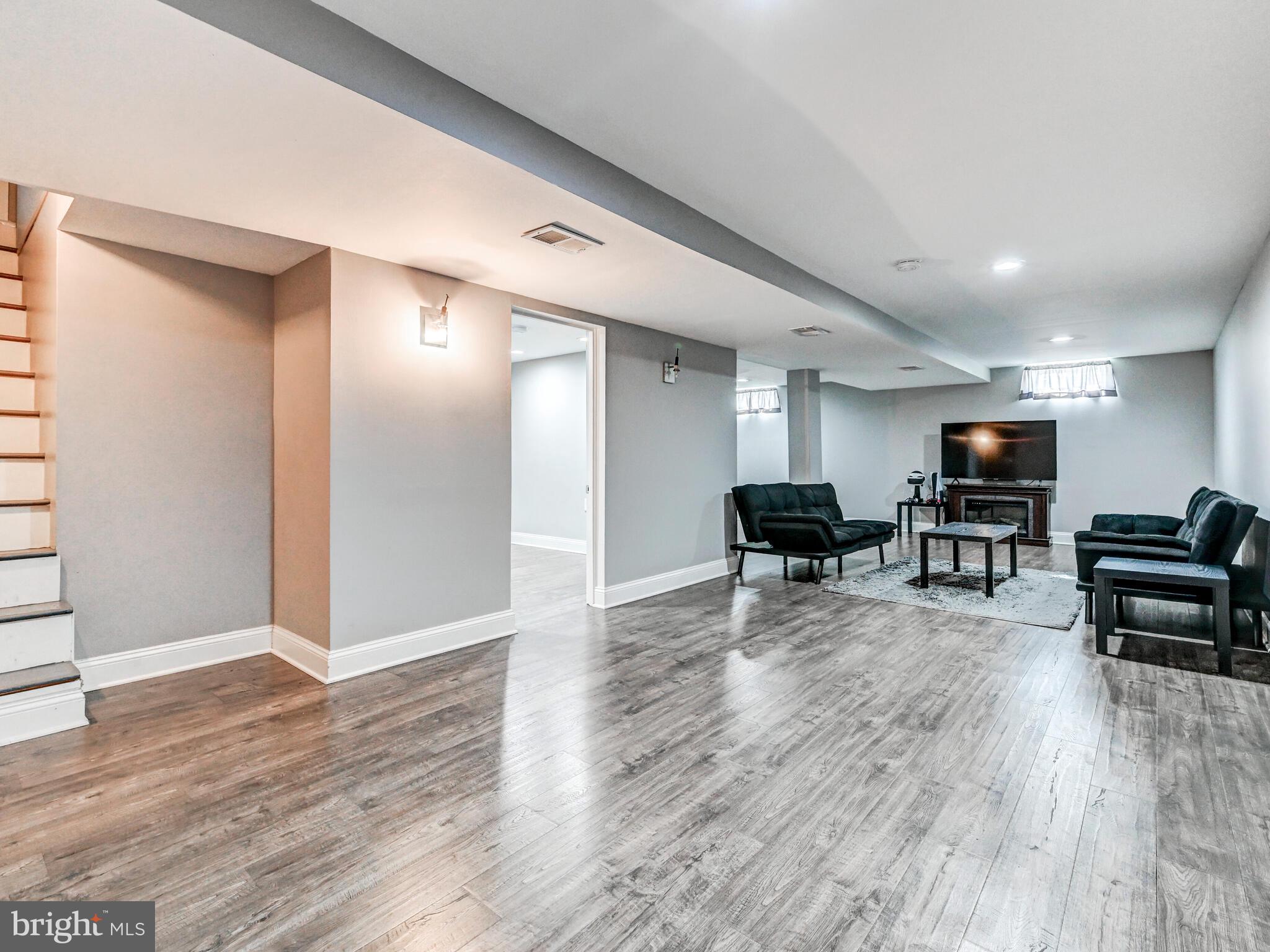 2712 Burridge Road Baltimore, MD 21234 - Photo 24 of 32 a living room with furniture and wooden floor
