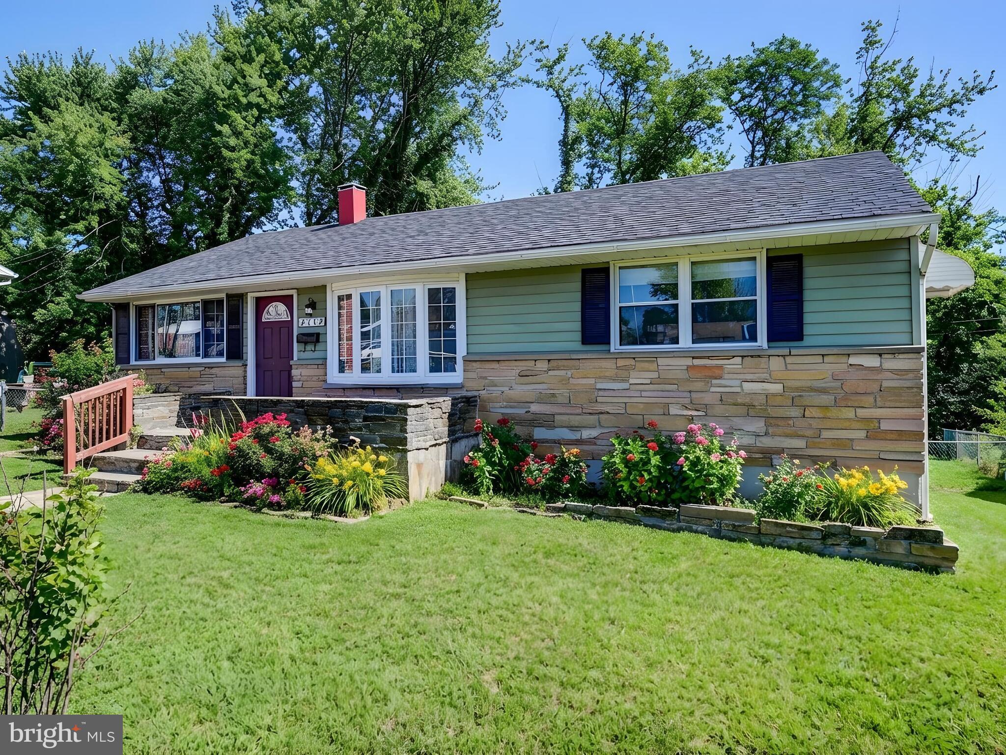 2712 Burridge Road Baltimore, MD 21234 - Photo 3 of 32 a front view of a house with garden