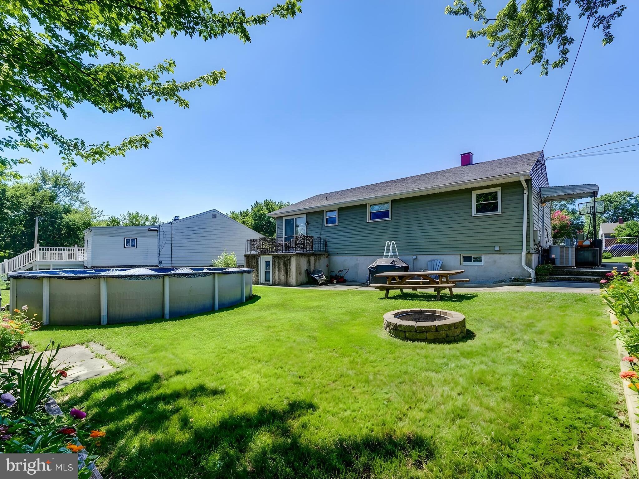 2712 Burridge Road Baltimore, MD 21234 - Photo 31 of 32 a backyard of a house with table and chairs