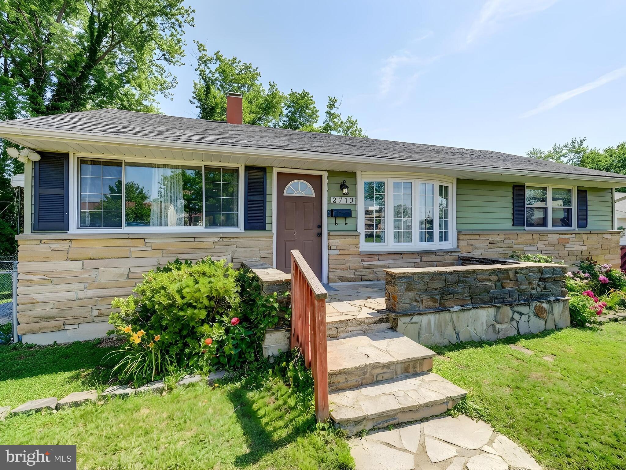 2712 Burridge Road Baltimore, MD 21234 - Photo 4 of 32 a front view of a house with a yard