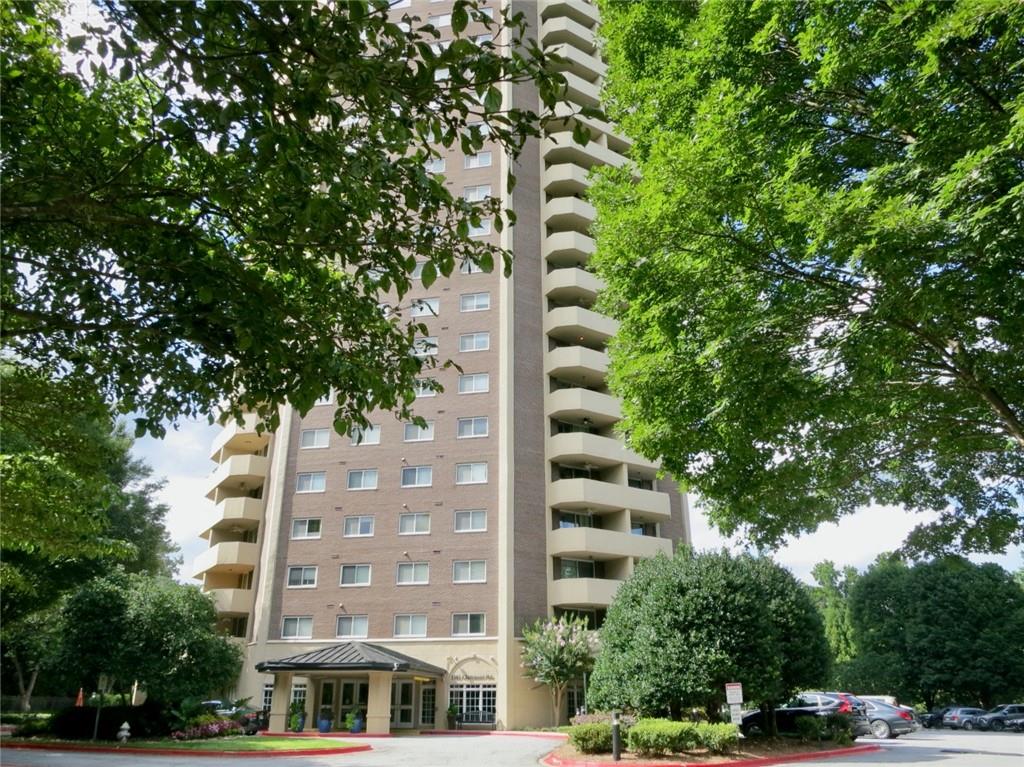 1501 Clairmont Road, Unit 713 Decatur, GA 30033 - Photo 1 of 29 a front view of multi story residential apartment building with trees