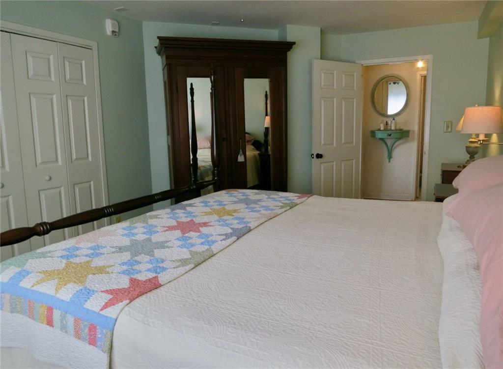 1501 Clairmont Road, Unit 713 Decatur, GA 30033 - Photo 15 of 29 a bedroom with a bed and a mirror