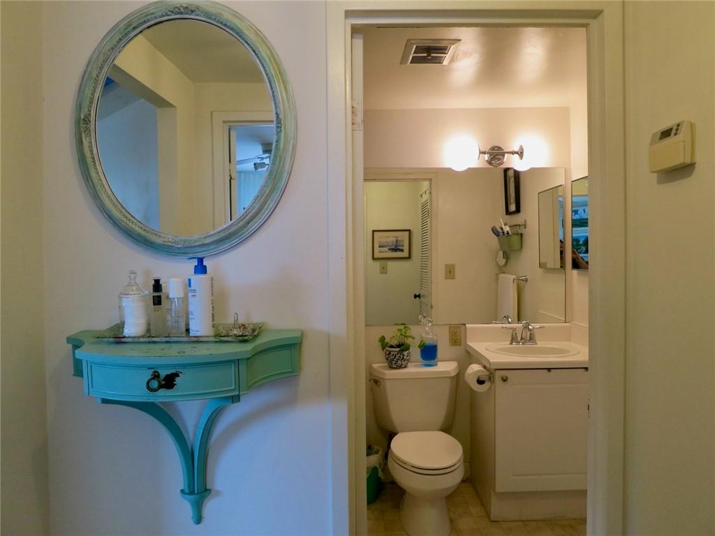 1501 Clairmont Road, Unit 713 Decatur, GA 30033 - Photo 16 of 29 a bathroom with a toilet sink and mirror