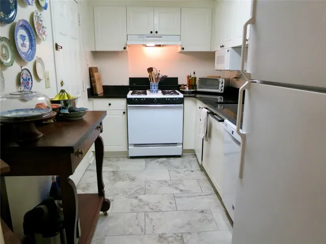 a kitchen with kitchen island and appliances