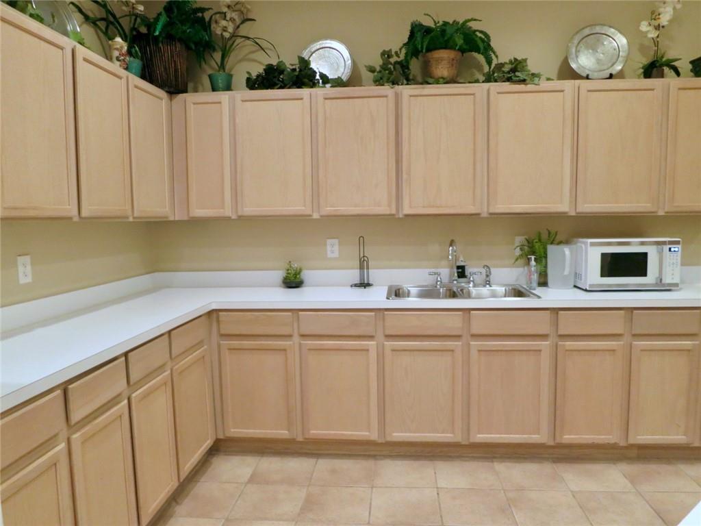 1501 Clairmont Road, Unit 713 Decatur, GA 30033 - Photo 24 of 29 a kitchen with white cabinets and sink
