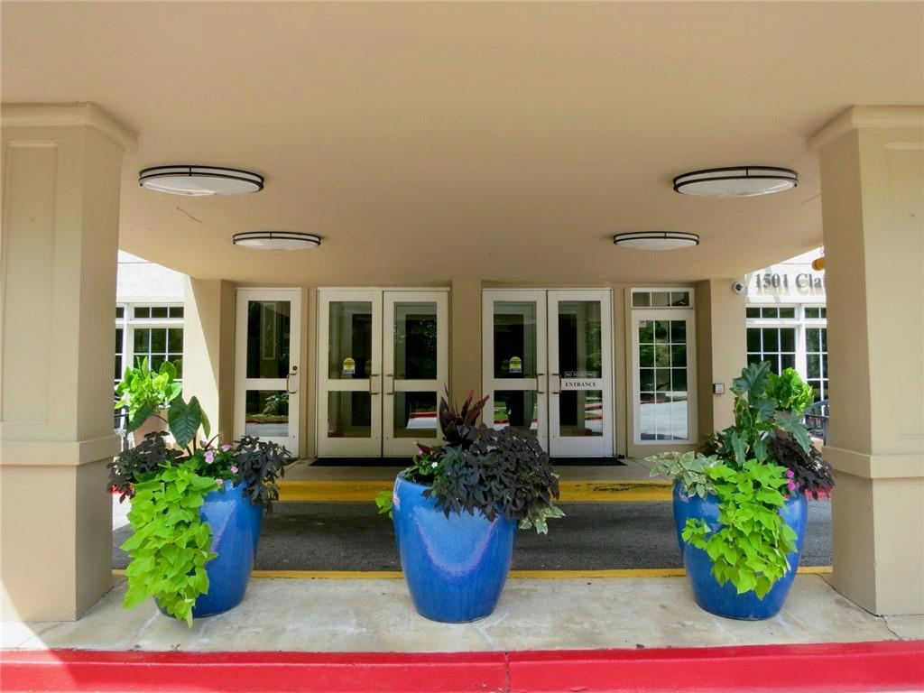 1501 Clairmont Road, Unit 713 Decatur, GA 30033 - Photo 3 of 29 a house view with a potted plant and a potted plant