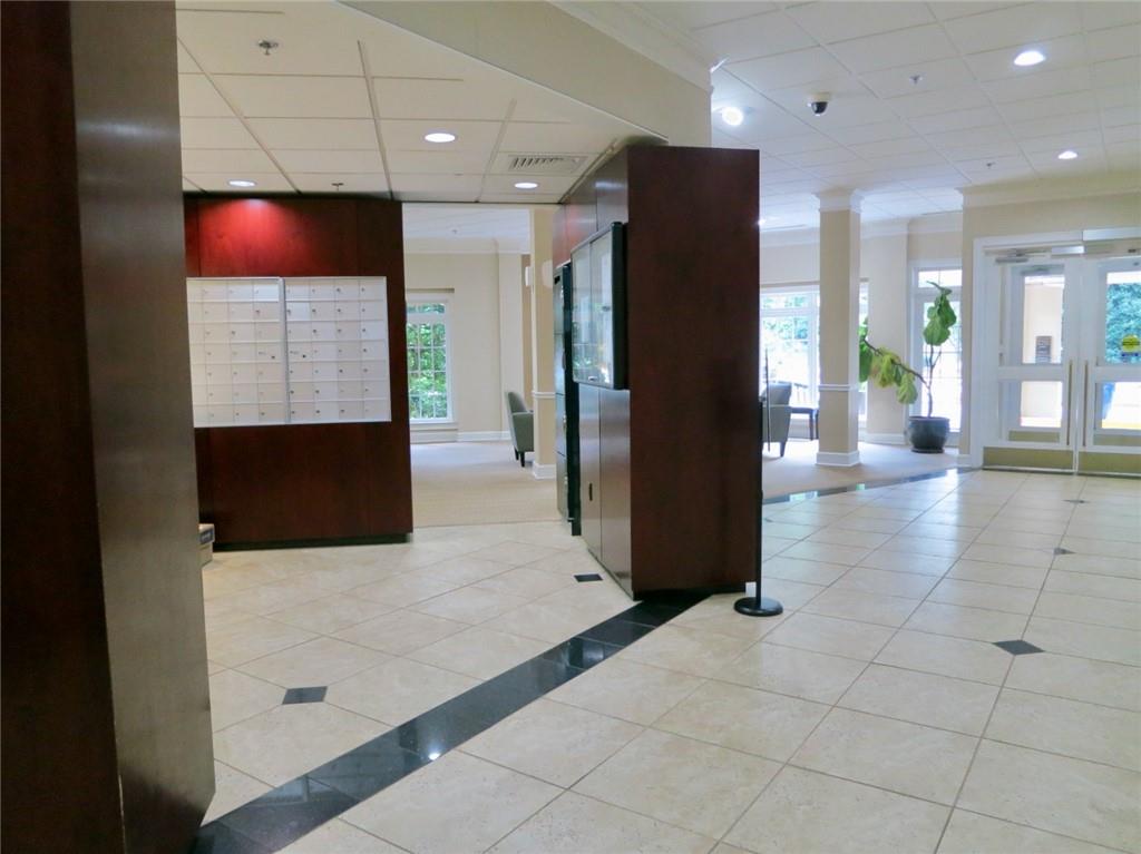 1501 Clairmont Road, Unit 713 Decatur, GA 30033 - Photo 6 of 29 a view of lobby with a couch and a flat screen tv