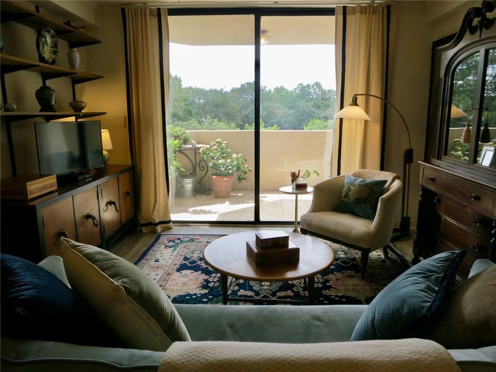 1501 Clairmont Road, Unit 713 Decatur, GA 30033 - Photo 9 of 29 a living room with furniture and a flat screen tv