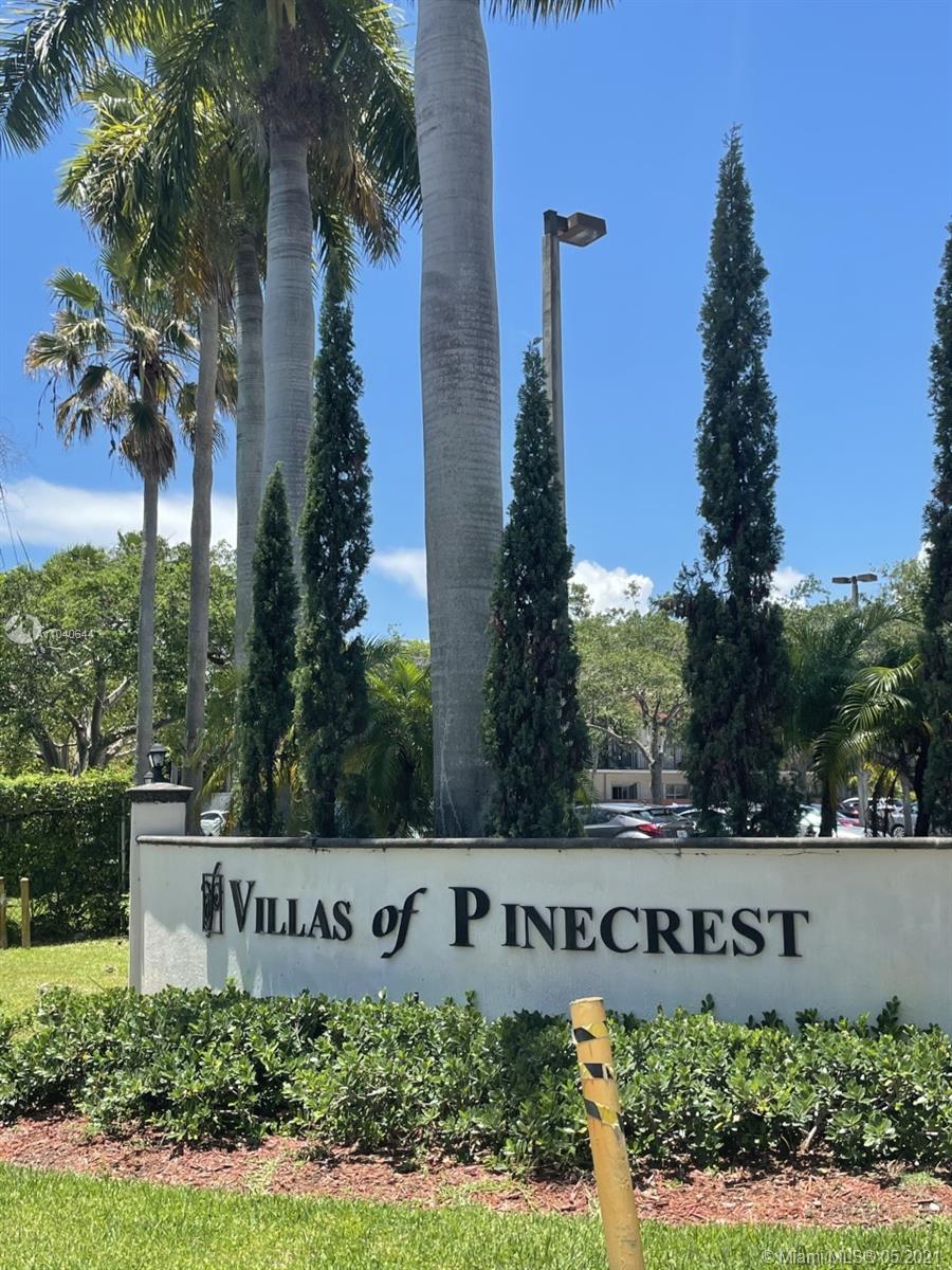 a view of a street with house and trees