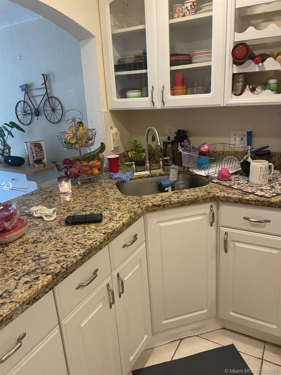 6709 North Kendall Drive, Unit 222 Pinecrest, FL 33156 - Photo 4 of 23 a kitchen with sink and cabinets