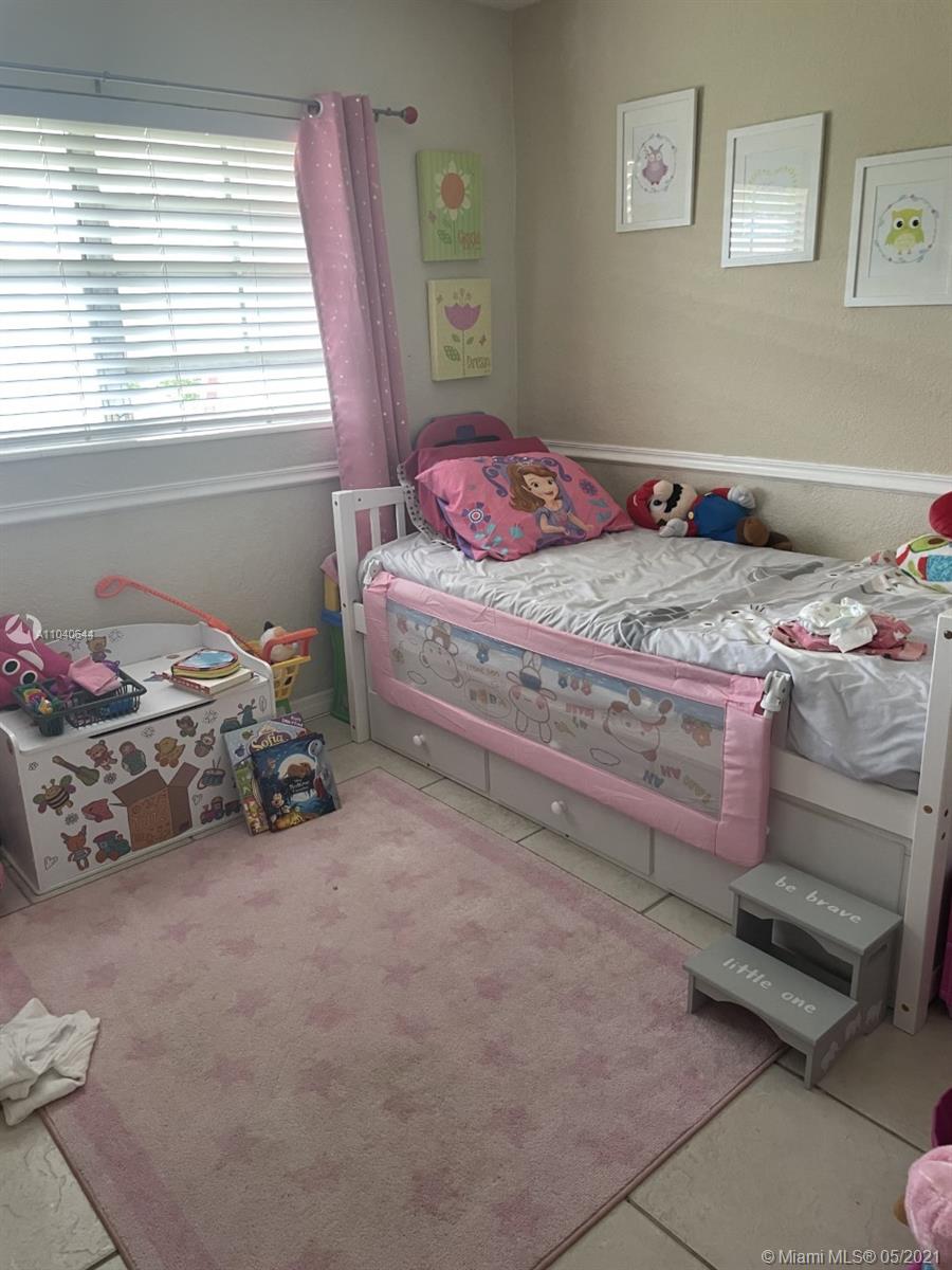 6709 North Kendall Drive, Unit 222 Pinecrest, FL 33156 - Photo 10 of 23 a bedroom with a bed and a window