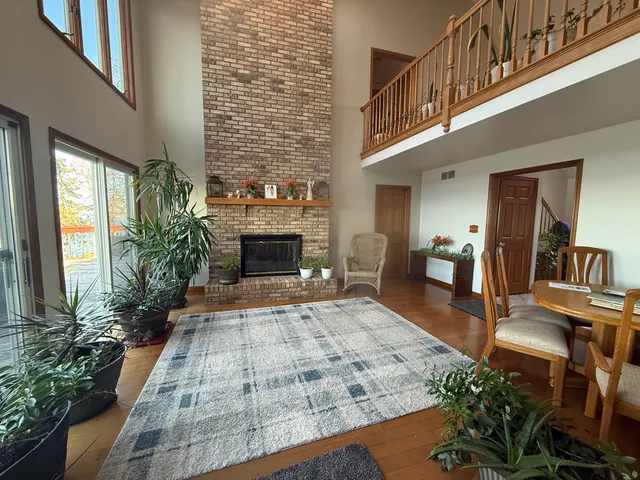 a view of an entryway with wooden floor